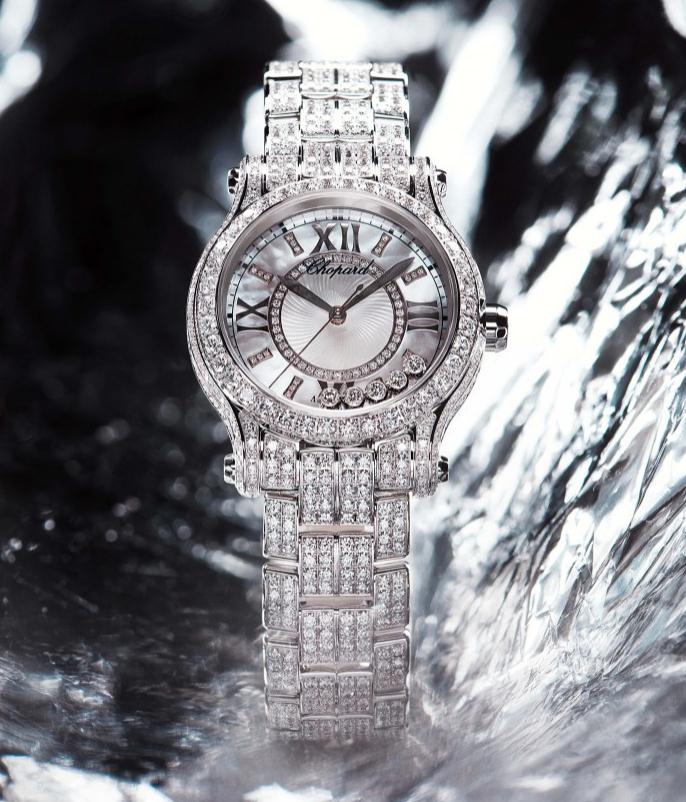 The 30 mm fake Chopard Happy Sport watch is made from 18k white gold and diamonds.