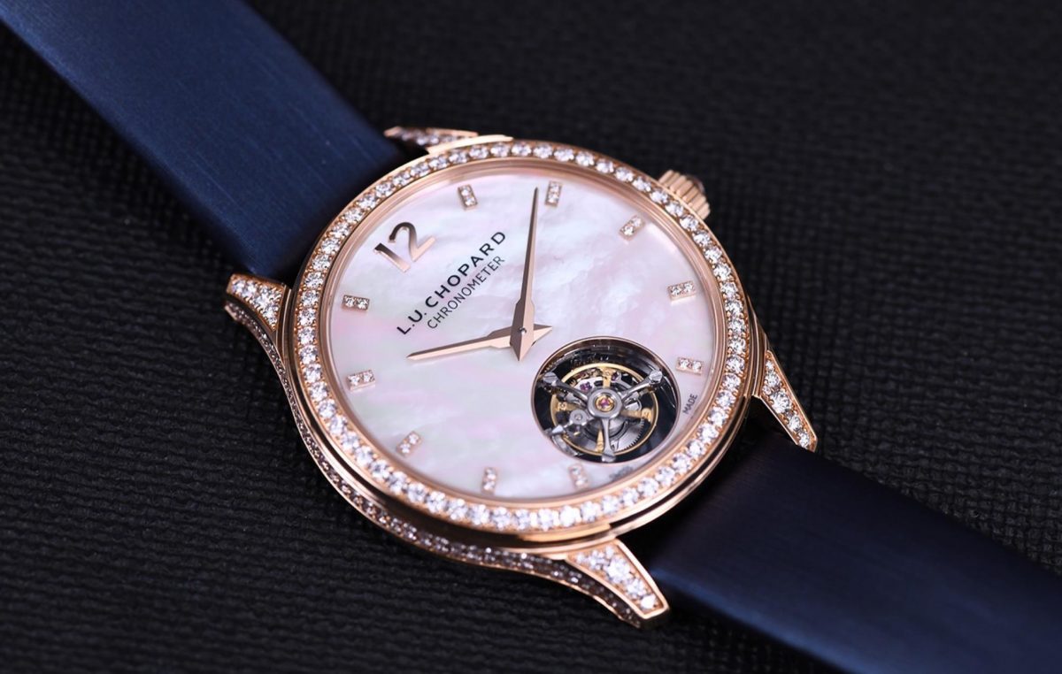 The white dial fake watch has a tourbillon.